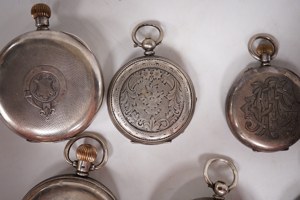 Three early to mid 20th century silver open faced pocket watches, with Roman or Arabic dials and subsidiary seconds, including two keyless and one key wind (Admiral Tacy Watch Co), together with one smaller silver open f